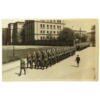 Wehrmacht soldiers marching in the town. Espenlaub militaria